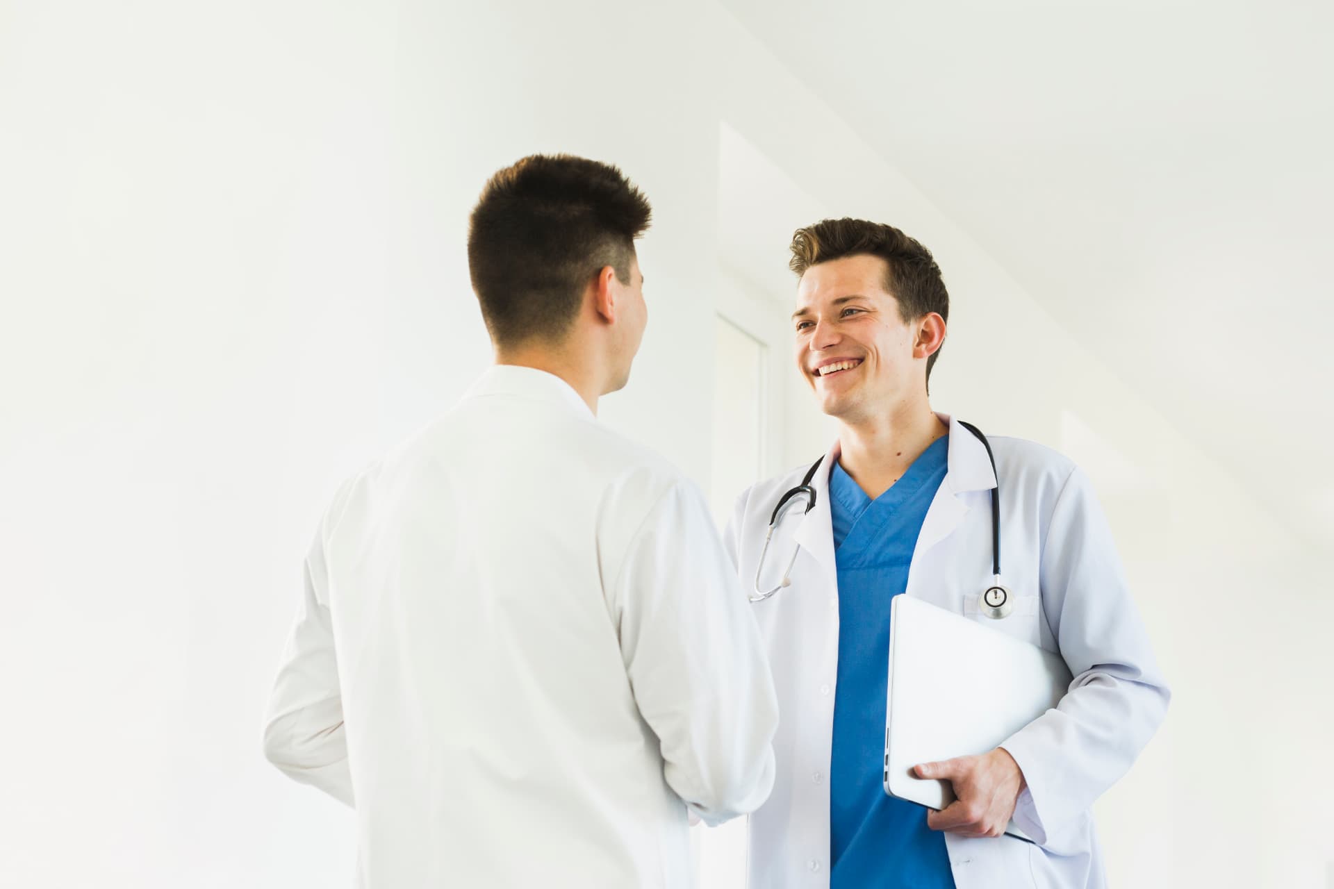 Doctor welcoming a patient during a friendly follow-up consultation