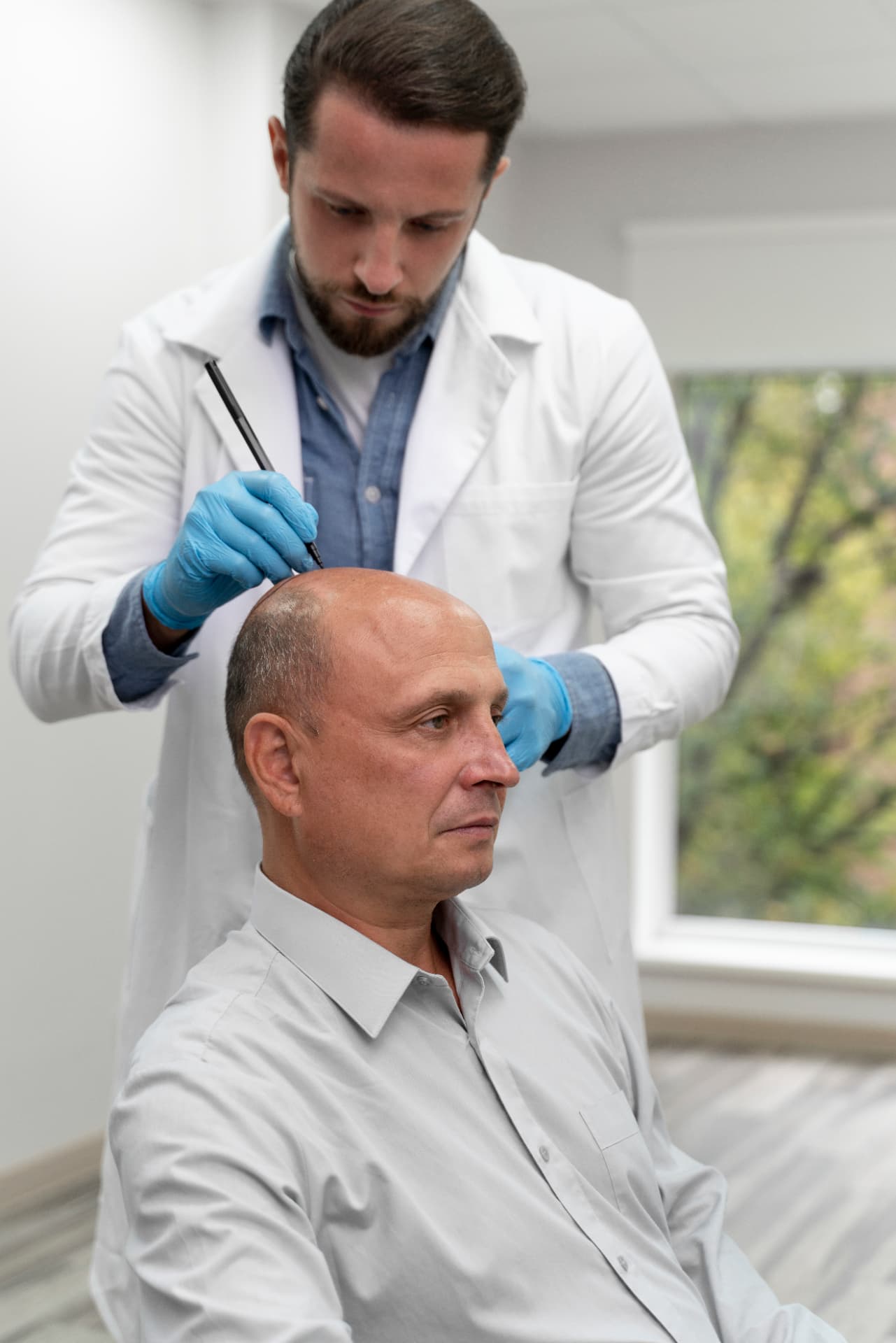 Clinician carefully performing a follicular unit extraction procedure