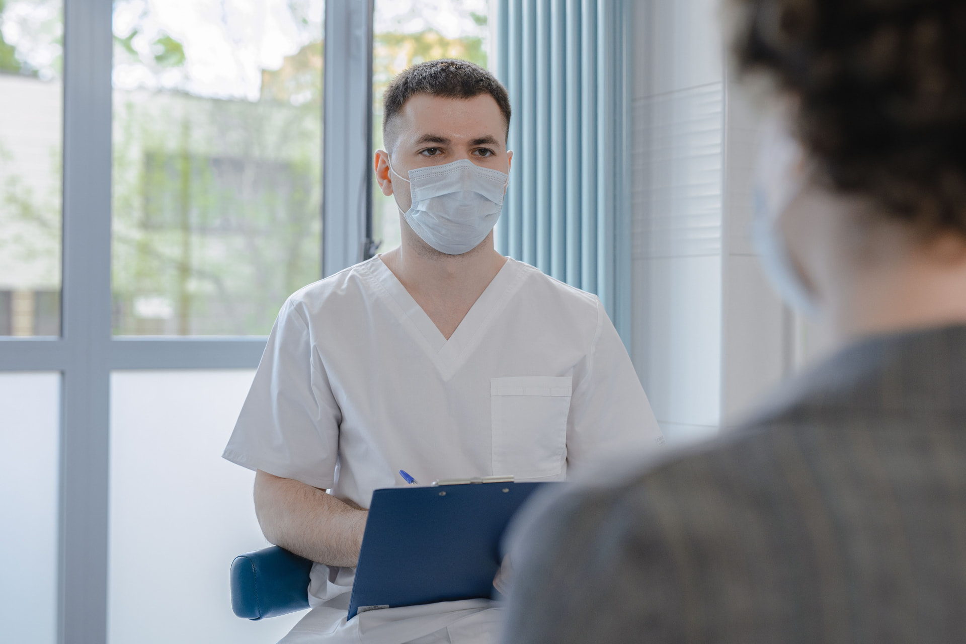 Clinician discussing a personalised treatment plan with a patient